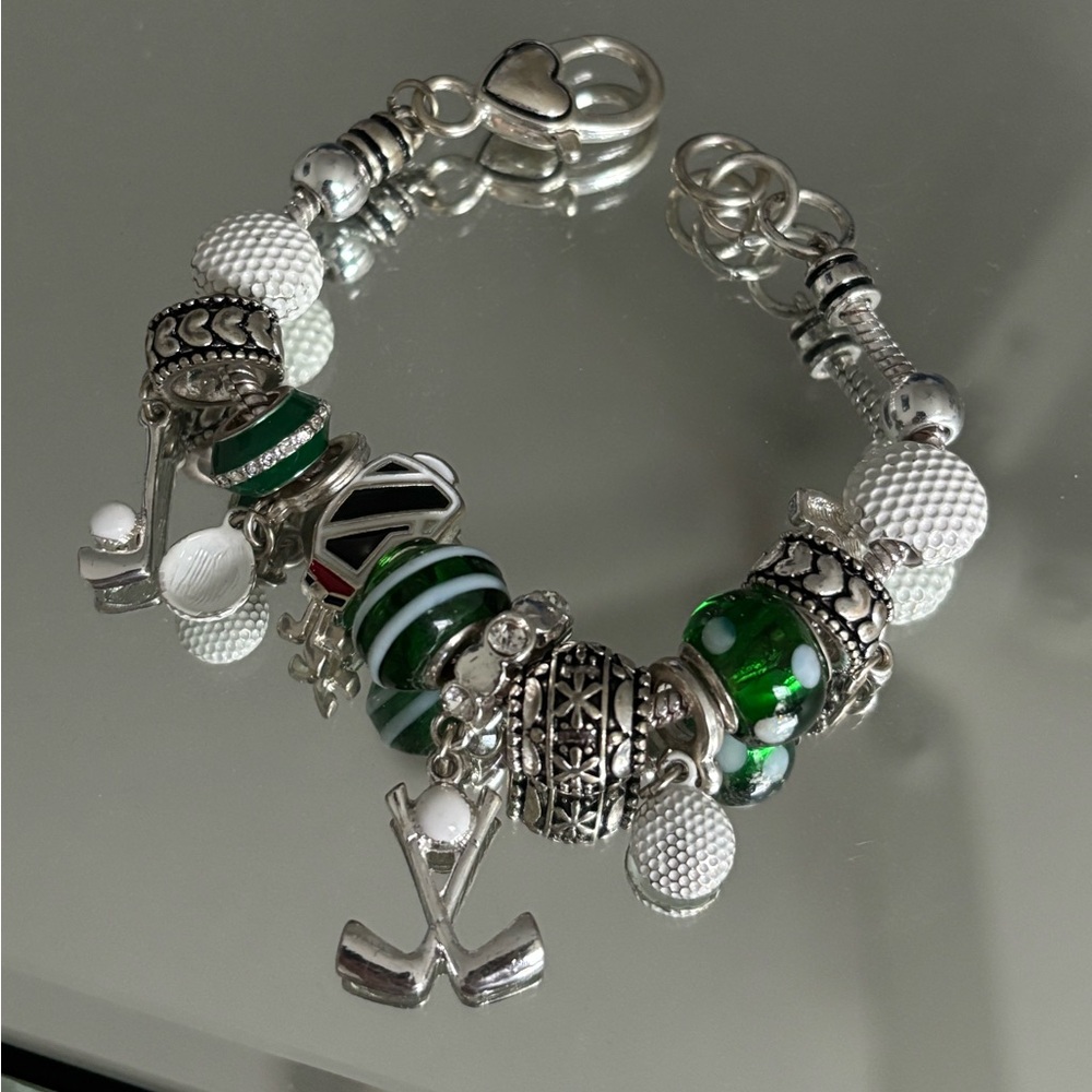 Pandora Silver and Green Charm Bracelet with Intricate Beads